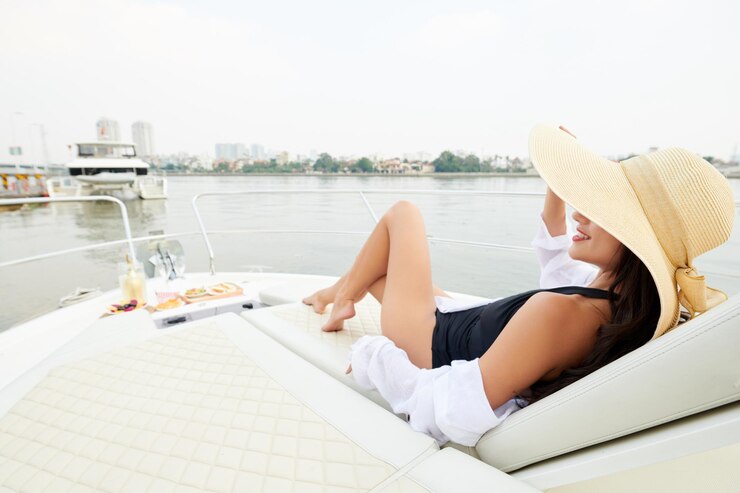 woman sunbathing on yacht bow 274689 31195 . Luxury Italy Travel Agent